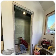 Blue Eagle Tiles installer working on a bathroom shower wall